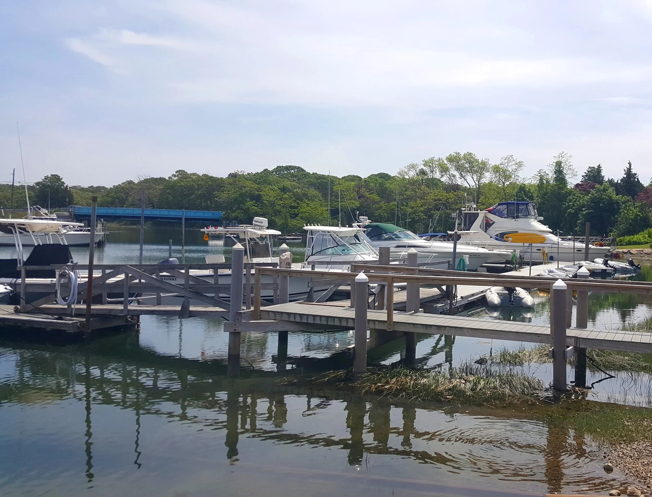 Boats in their slips along the docks on the Pocasset River