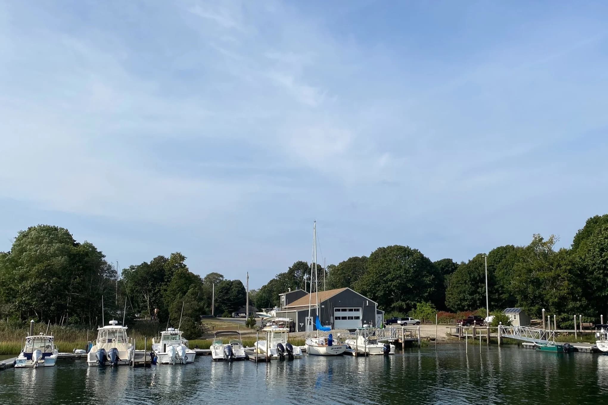 The marina's boat basin with the service building and travel yard behind