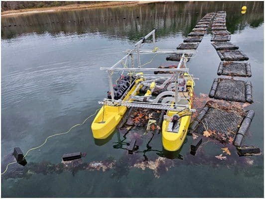 Autonomous catamaran robot working rows of oyster bags